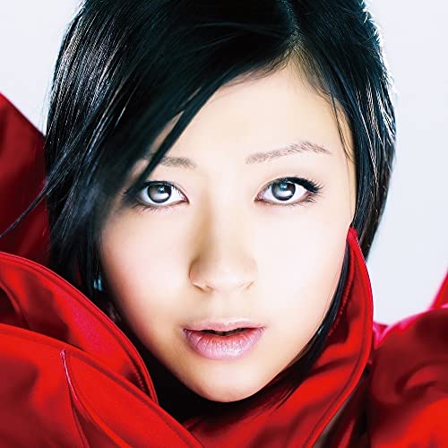 Hikaru Utada portrait with black hair and red fabric framing face.
