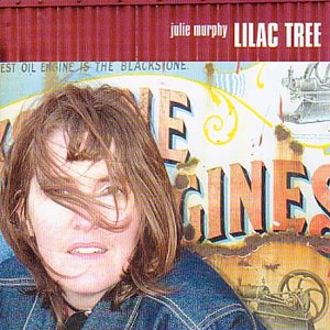 Julie Murphy's album cover: a woman with messy hair in front of a mural.
