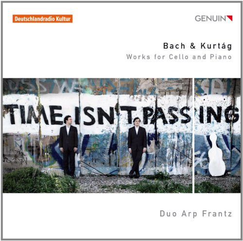 CD cover featuring two men in black suits standing before a graffiti wall.