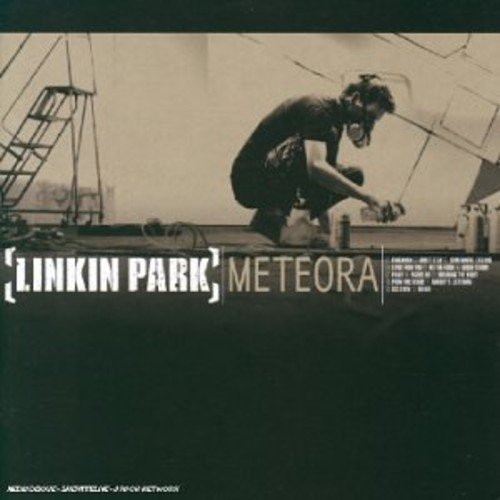 "Linkin Park Meteora CD cover featuring a man crouching on a rooftop."