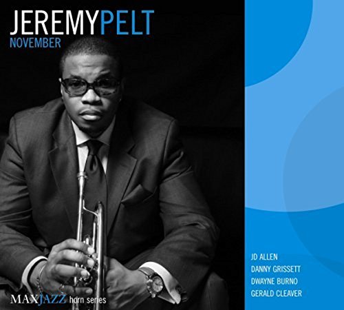 "Album cover featuring a man in a suit holding a trumpet, black and blue design."