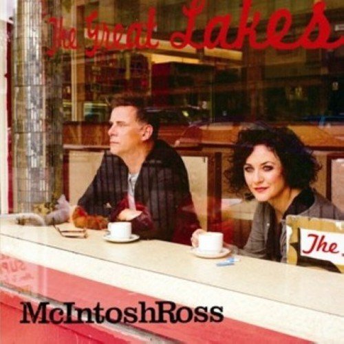 "Album cover with man and woman sitting at a diner counter."