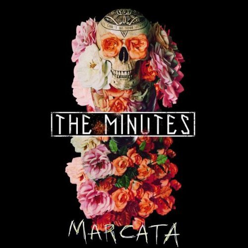 Album cover with a skull surrounded by flowers on a black background.