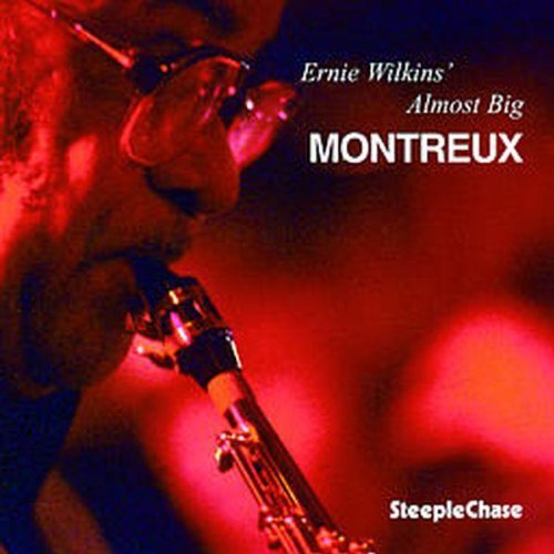 "Album cover featuring a close-up of a man playing a saxophone."