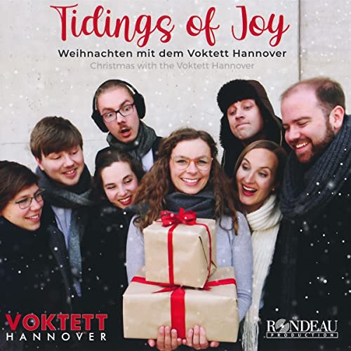 CD cover featuring a group of smiling people and gift boxes.