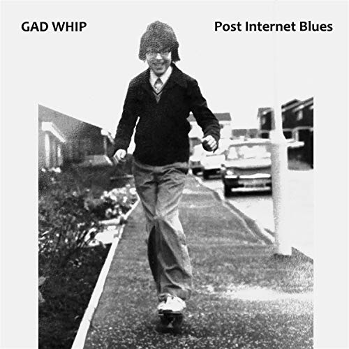 Black and white CD cover featuring a person skateboarding outdoors.