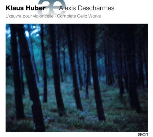 "CD cover with a dark forest image and white border, featuring text."
