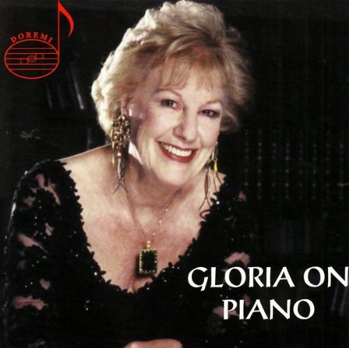 "CD cover featuring a smiling woman in a black dress with 'Gloria on Piano' text."