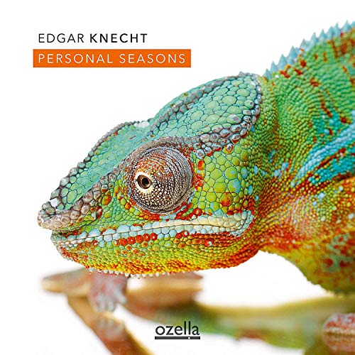 "Album cover featuring a vibrant green chameleon on a white background."