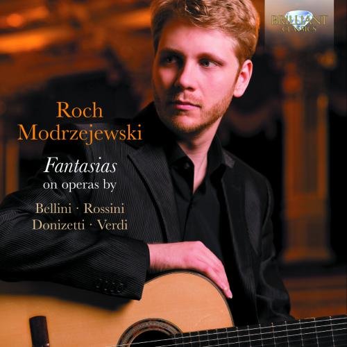 "Man in black suit holding a guitar, album cover with text."
