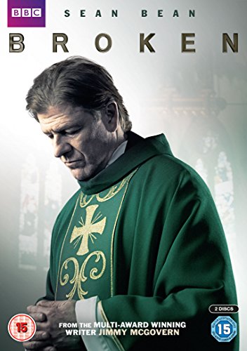 "Sean Bean in a green robe with gold cross on the DVD cover."