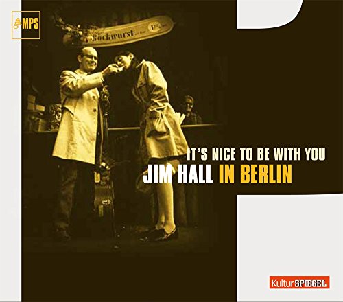 "CD cover with sepia-toned image of two men adjusting each other's ties on stage."
