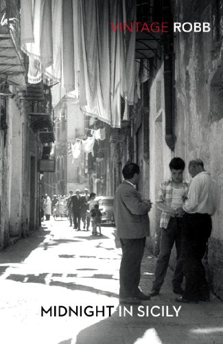 "Book cover with black-and-white street scene, three men, and title 'Midnight in Sicily'."