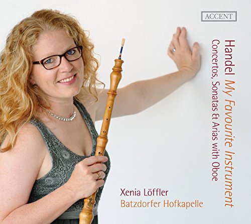 CD cover with a smiling woman holding an oboe, against a white background.