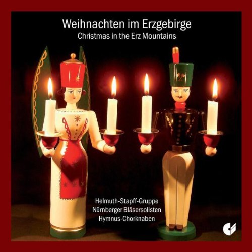 "Christmas CD cover featuring two candle-holding figurines against a dark background."