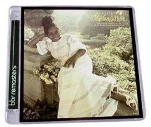 "Album cover featuring a woman in a white dress leaning on a stone fountain."