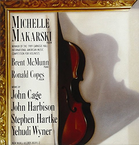 "CD cover with a violin and shadowy profile, ornate gold frame."