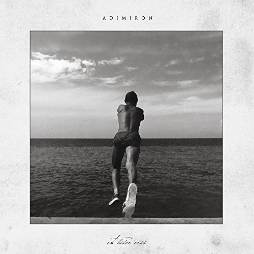 Black and white album cover featuring a person jumping towards the ocean.