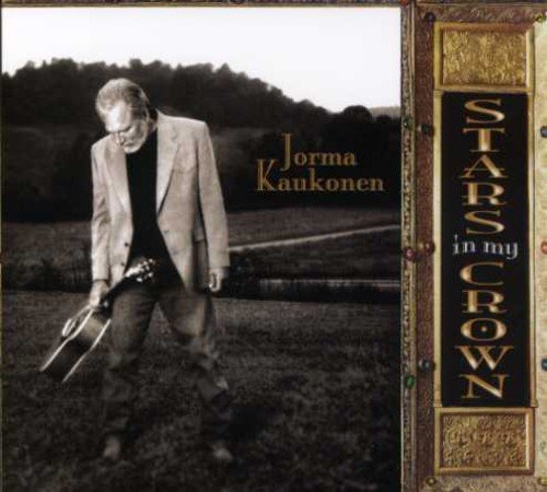 "CD cover with a man in a field, holding a guitar, with the title 'Stars in My Crown'."