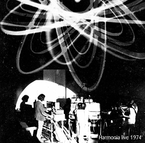 Black and white album cover with musicians and abstract light patterns.