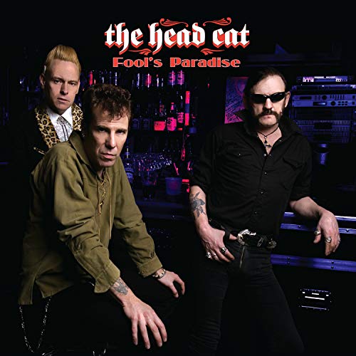 Three musicians posing in a dimly lit bar, album cover.
