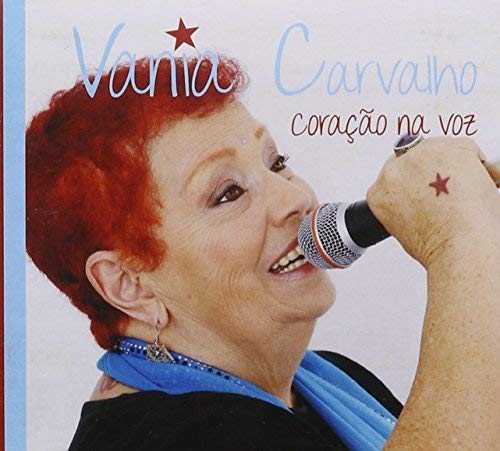 Vania Carvalho singing into a microphone, album cover for "Coração Na Voz".