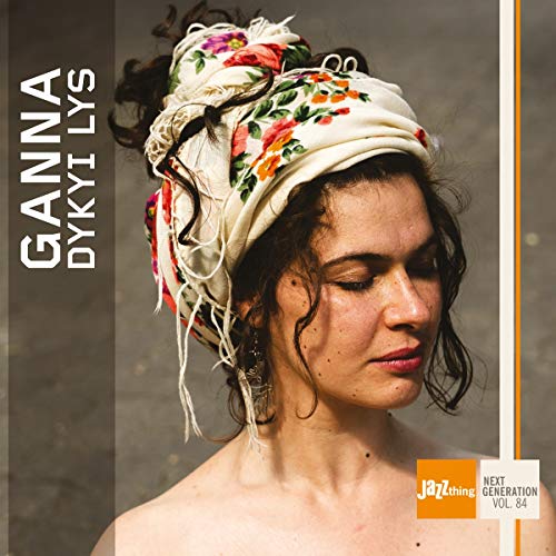 CD album cover featuring a woman with a floral headscarf and closed eyes.