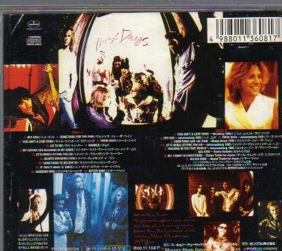 Bon Jovi "These Days" double CD back cover with tracklist and band photos.