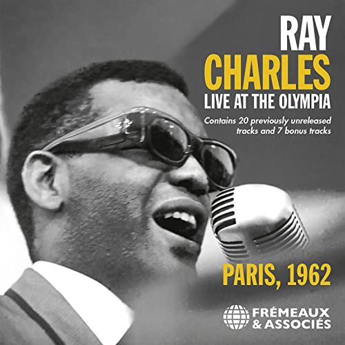 Ray Charles singing into a microphone, album cover for "Live At The Olympia.