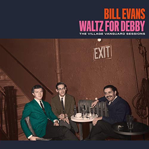 Bill Evans album cover featuring musicians in a dimly lit club.