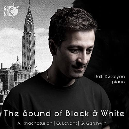 Black and white portrait of pianist Raffi Besalyan with New York skyline.