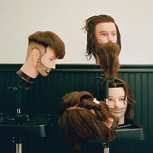 Vinyl album cover featuring three mannequin heads with varied hairstyles.