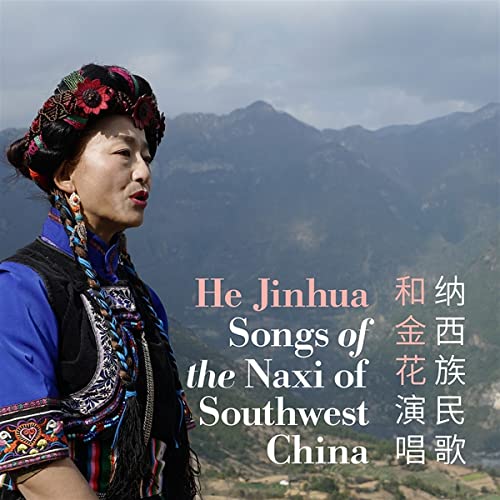Woman in traditional Naxi clothing with mountainous landscape background.