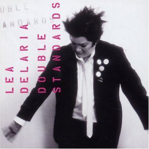 CD cover: person in suit with text "Double Standards" vertically aligned.