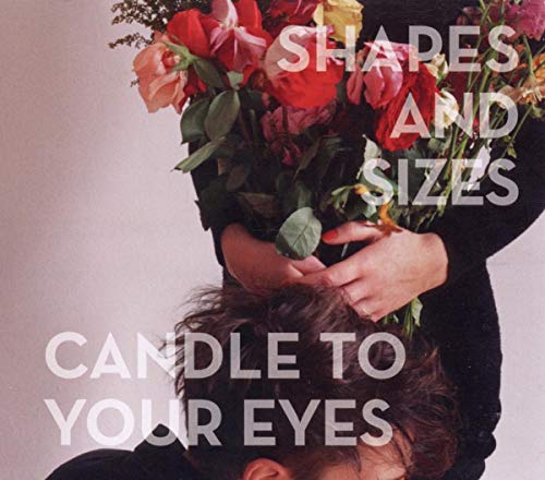 CD cover with flowers obscuring a person’s face and hands.