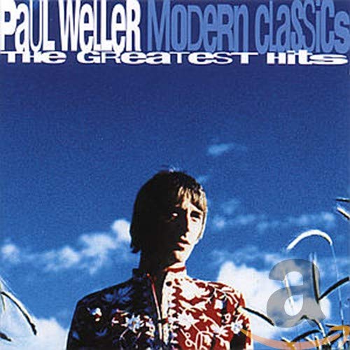 Paul Weller album cover: portrait against a blue sky with clouds.