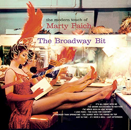 "CD cover art: woman in red dress and feathered headdress sitting in a dressing room."
