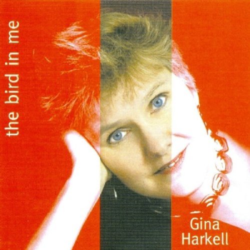 Album cover with a woman's face on a red background, titled "The Bird in Me".