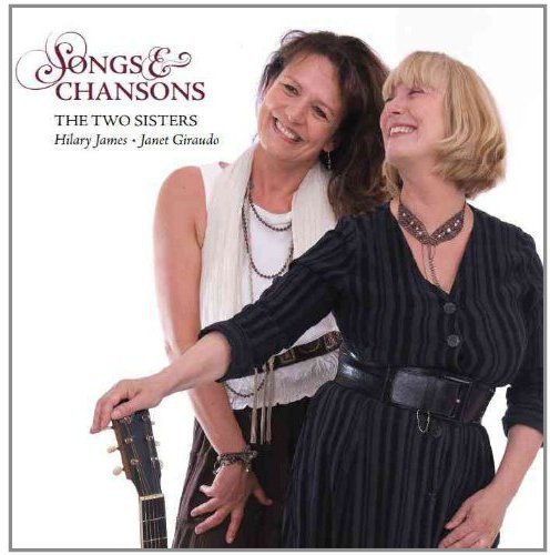 CD cover featuring two smiling women, one holding a guitar, against a white background.