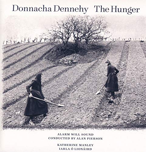 "Black and white album cover with two women working in a barren field."