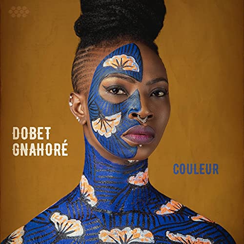 Dobet Gnahoré album cover, portrait of a woman with face paint.