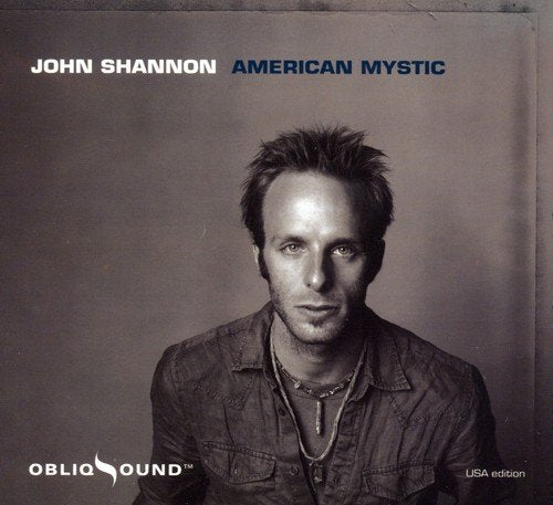"CD cover featuring a black-and-white portrait of John Shannon."