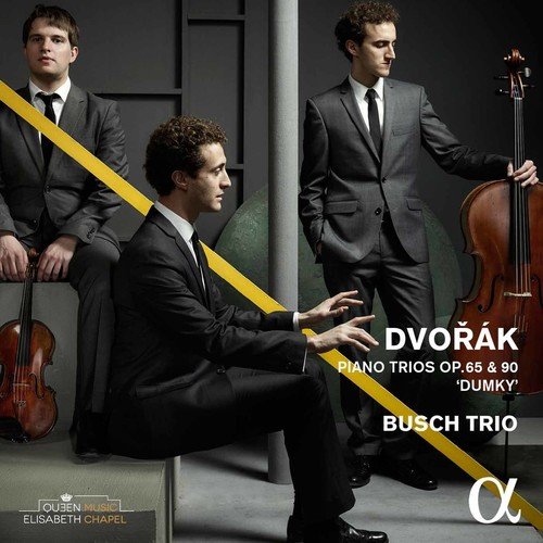 CD cover with three men in suits, one playing piano, against a dark background.