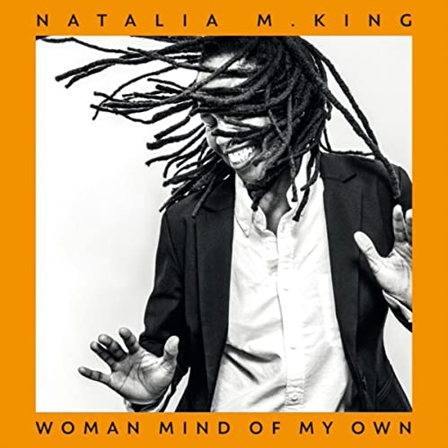 Natalia M. King album cover featuring a smiling woman with dreadlocks.