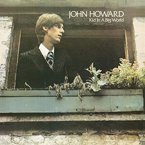 CD cover: man in suit looking out a window.