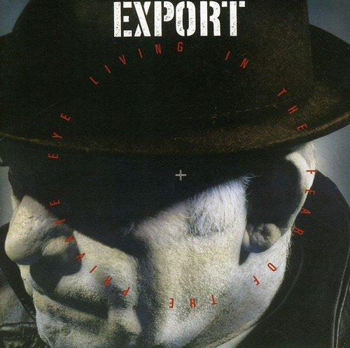 CD cover: man in a fedora, shadowed face, red text overlay.