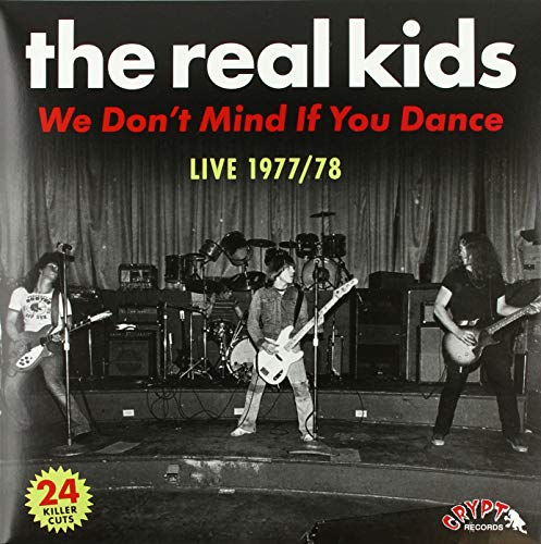 Vinyl album cover featuring a black and white band performance photo.