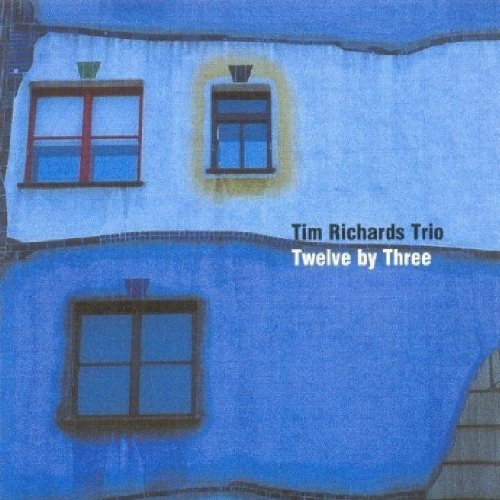 CD cover: blue building with three windows, album title text.