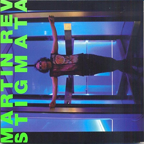 Vinyl record cover for Martin Rev’s “Stigmata” featuring a man in blue light.