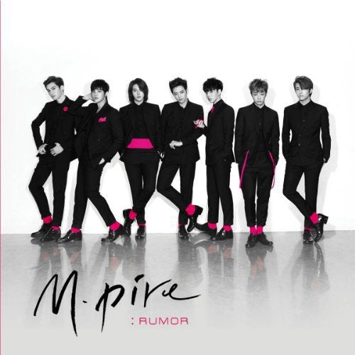 Seven men in black suits with pink accents pose for a CD cover.